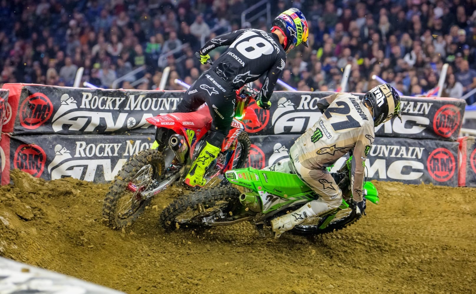 Jason Anderson passes Jett Lawrence at the 2024 Detroit Supercross